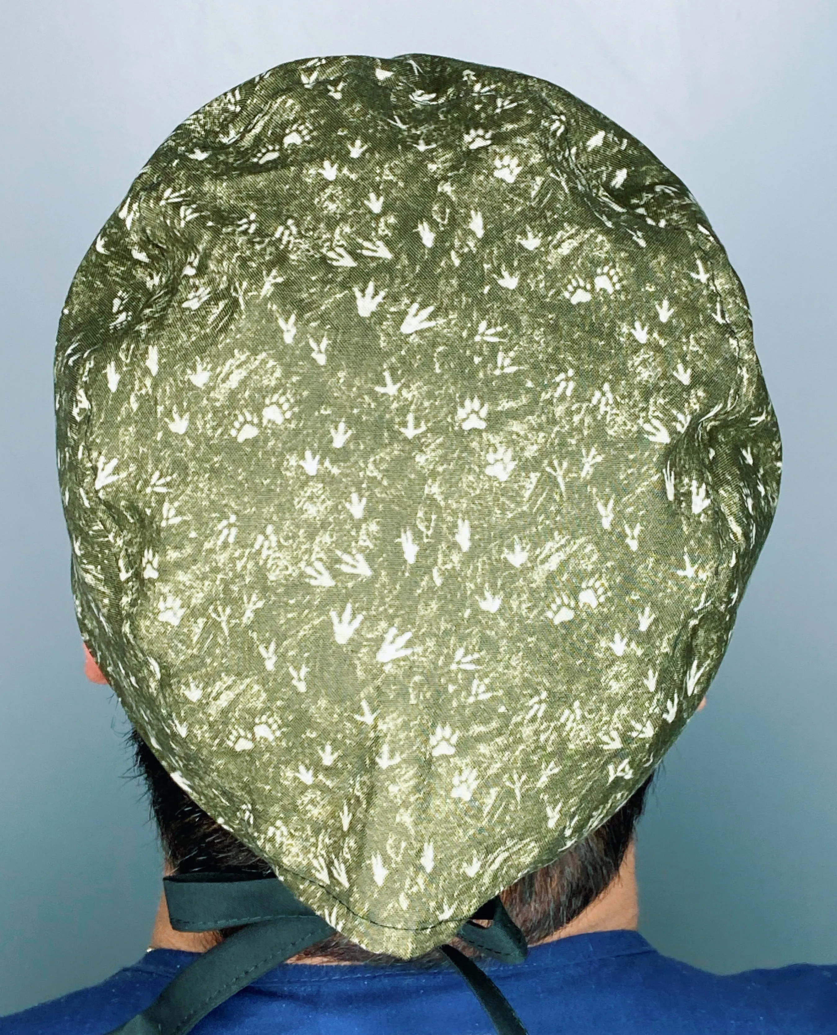 Dinosaurs Foot Prints on Hunter Green Unisex Animal Scrub Cap