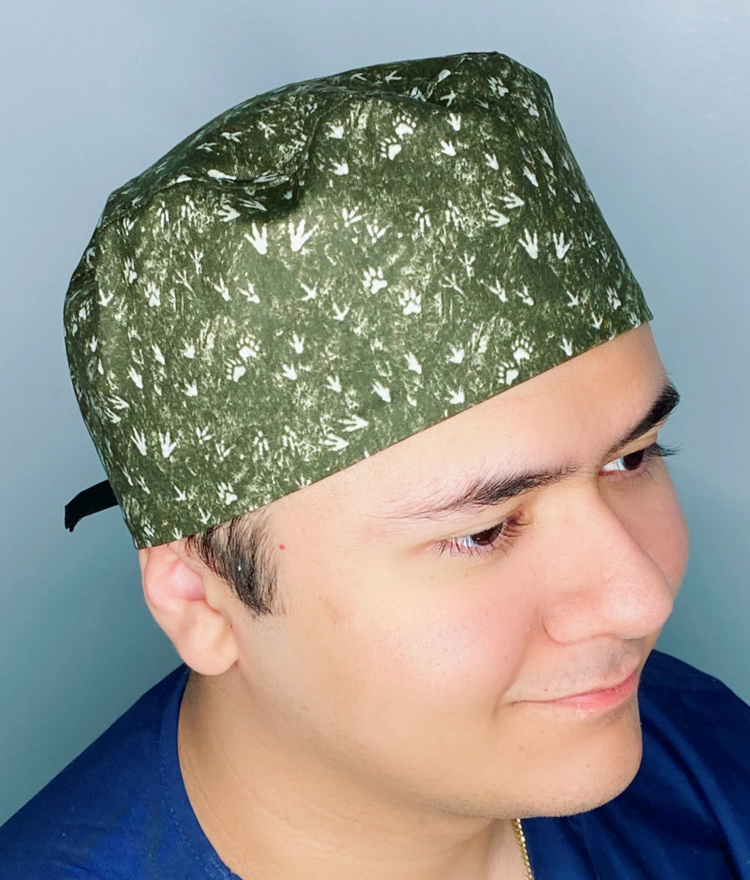 Dinosaurs Foot Prints on Hunter Green Unisex Animal Scrub Cap